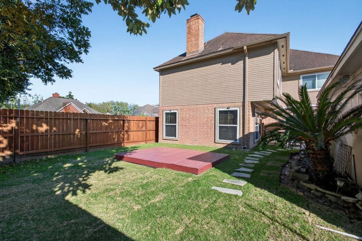 19115 Keyturn Lane Humble, TX 77346 - Photo 30 of 32 a view of backyard with deck and wooden fence