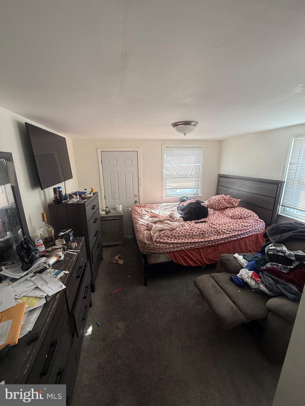 619 West 5th Street Chester, PA 19013 - Photo 16 of 17 a bedroom with a bed and a chair