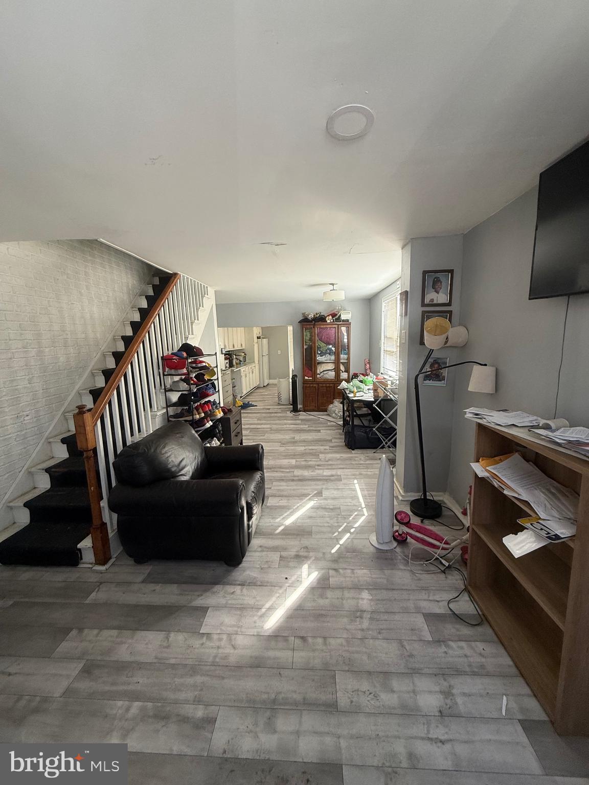619 West 5th Street Chester, PA 19013 - Photo 3 of 17 a living room with furniture and a gym machine