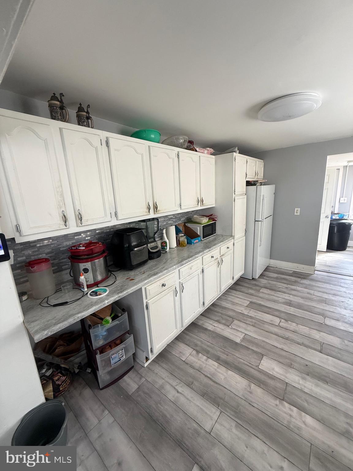 619 West 5th Street Chester, PA 19013 - Photo 5 of 17 a kitchen with stainless steel appliances granite countertop a sink a stove and cabinets