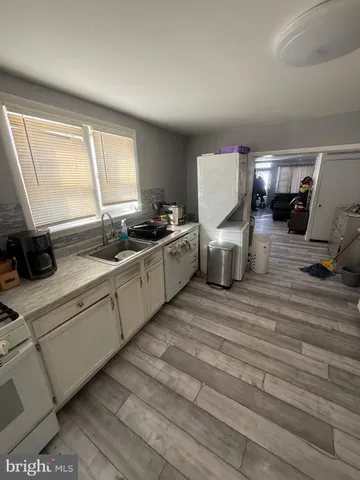 a kitchen with a stove and a refrigerator