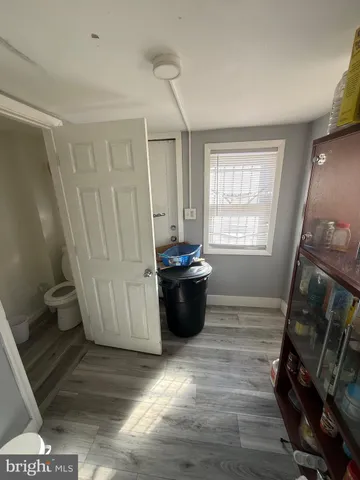 a view of a living room with furniture and a window