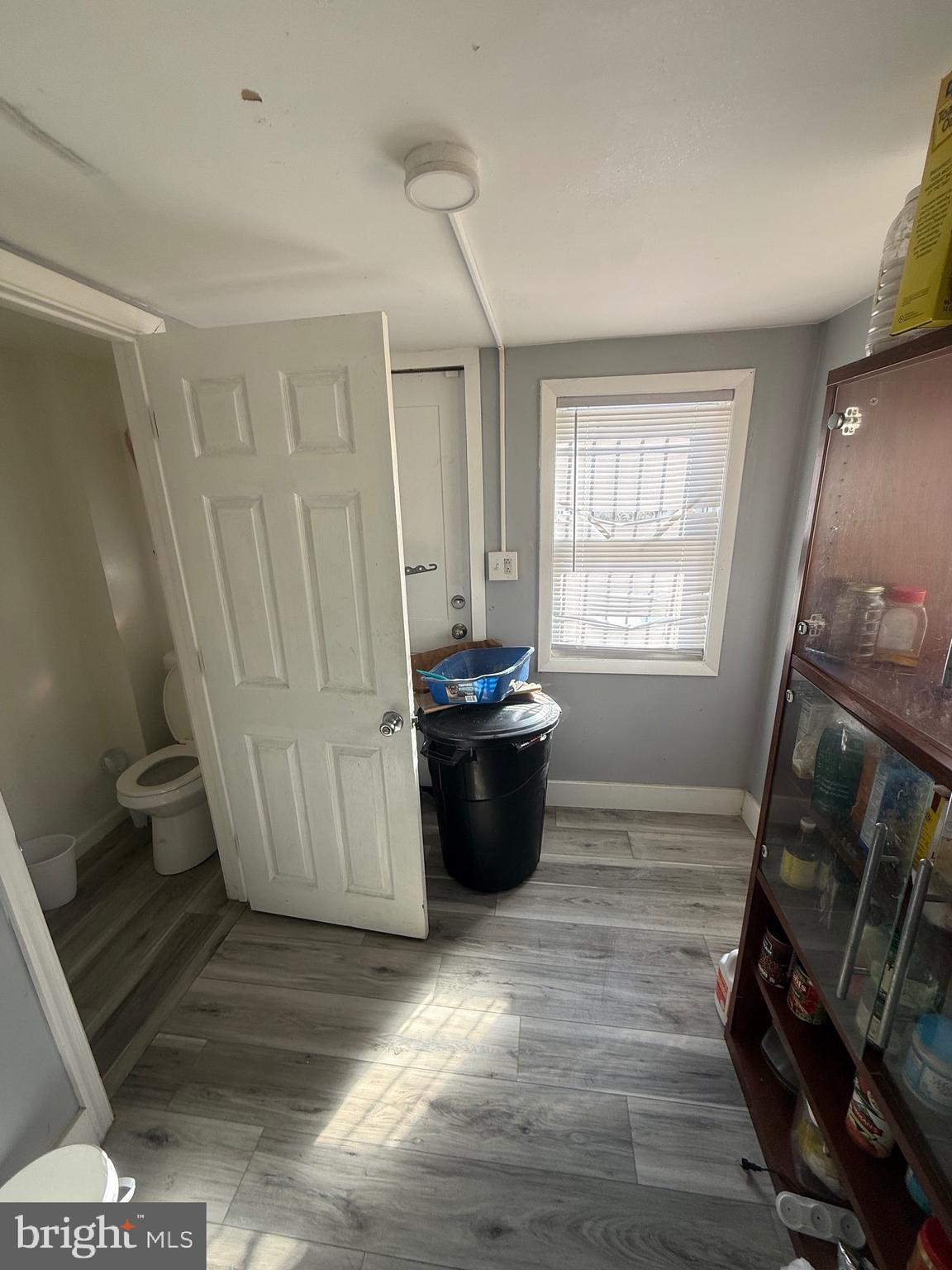 619 West 5th Street Chester, PA 19013 - Photo 8 of 17 a view of a living room with furniture and a window