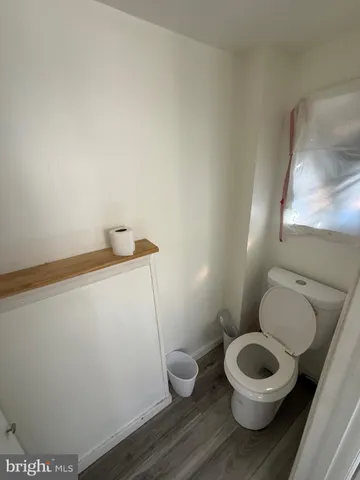 a bathroom with a toilet and a sink