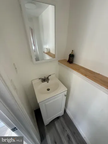 a bathroom with a sink and mirror