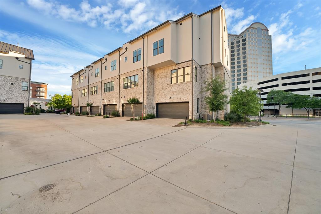 5437 Patterson Street Irving, TX 75039 - Photo 11 of 40 View of large corner unit with a 2 car garage and driveway. pre wired for EV charger.