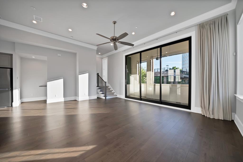 5437 Patterson Street Irving, TX 75039 - Photo 18 of 40 Spare room with ceiling fan, dark wood-style floors, recessed lighting, and ornamental molding