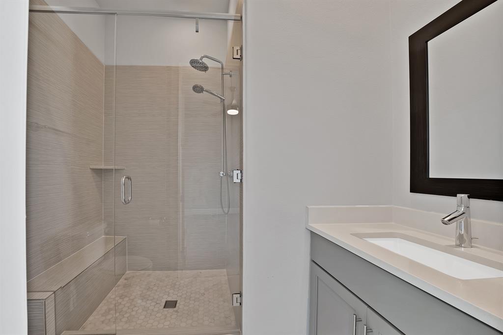 5437 Patterson Street Irving, TX 75039 - Photo 25 of 40 Full bathroom with vanity and a shower stall