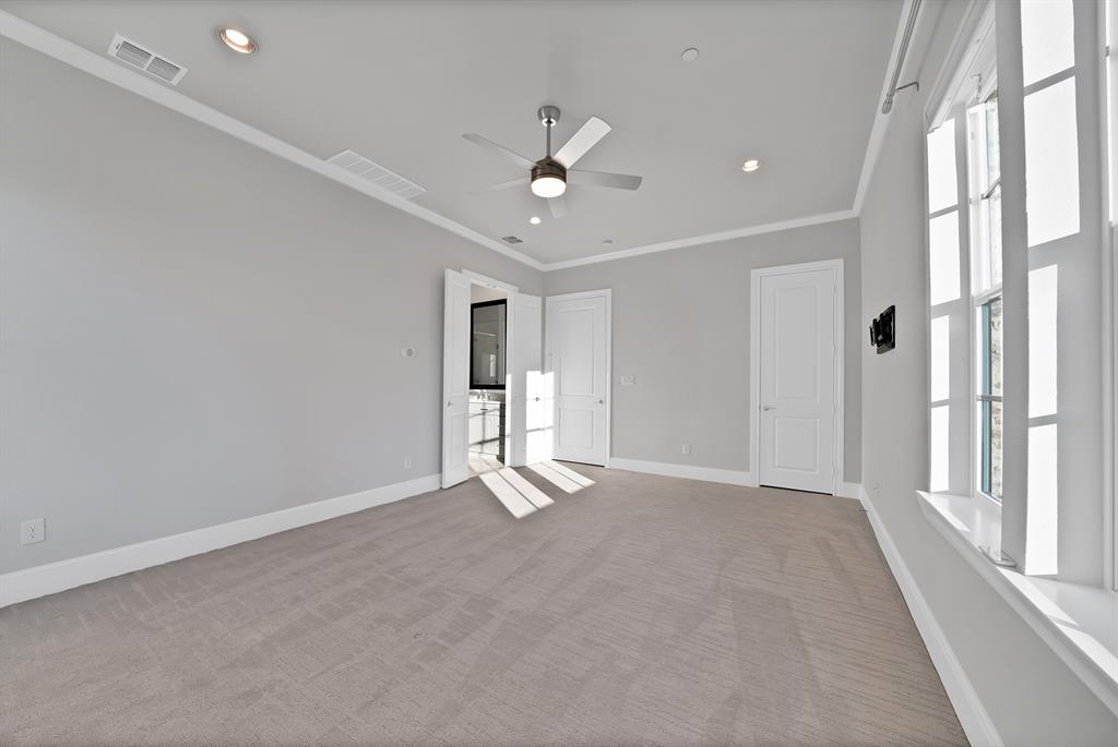 5437 Patterson Street Irving, TX 75039 - Photo 27 of 40 Unfurnished bedroom with light colored carpet, ornamental molding, recessed lighting, and a ceiling fan