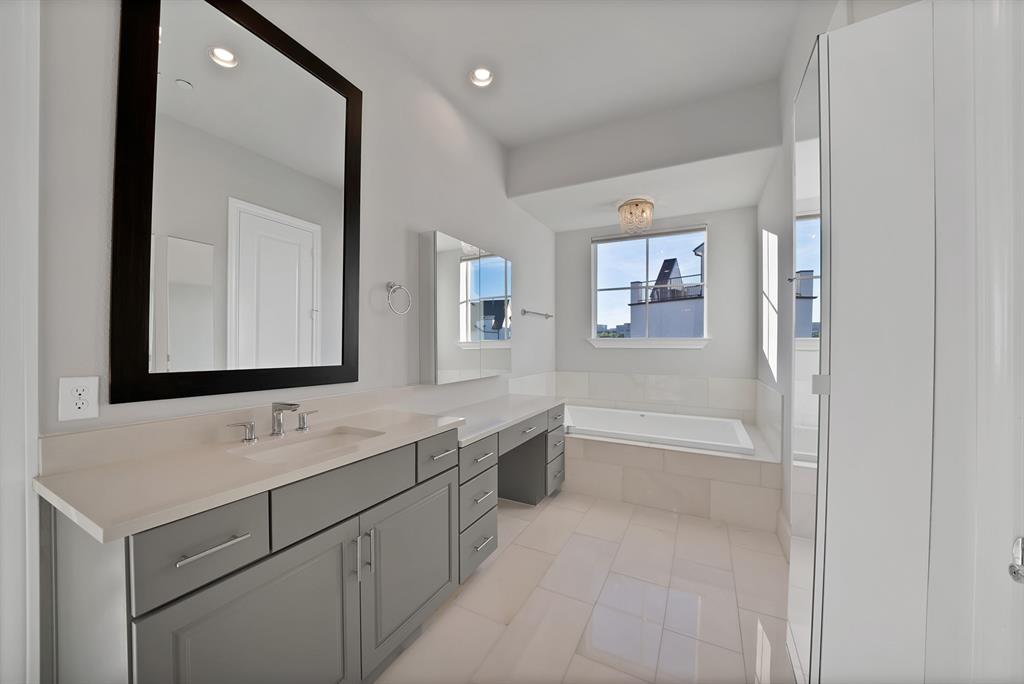 5437 Patterson Street Irving, TX 75039 - Photo 30 of 40 Full bathroom featuring vanity, a bath, light tile patterned flooring, and recessed lighting