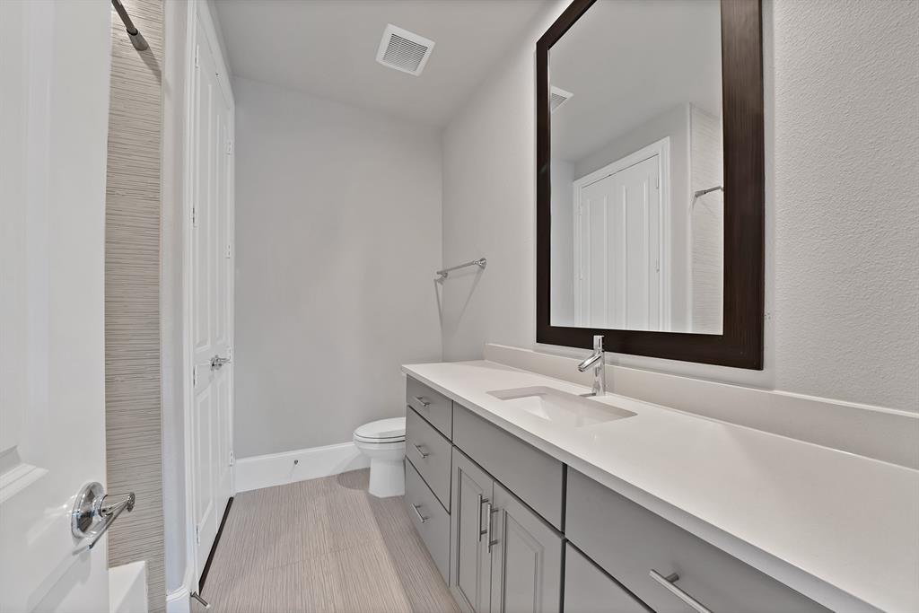5437 Patterson Street Irving, TX 75039 - Photo 33 of 40 Bathroom featuring vanity and toilet