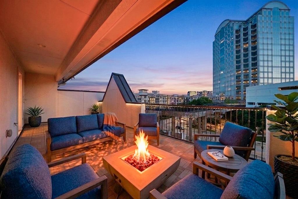 5437 Patterson Street Irving, TX 75039 - Photo 5 of 40 Private Top floor Terrace with fire pit. Furniture staged with AI