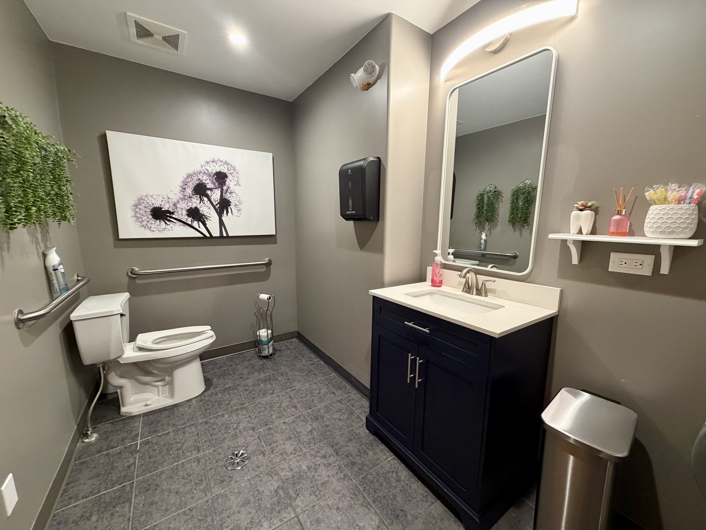 134 West State Street Sycamore, IL 60178 - Photo 10 of 20 a bathroom with a toilet a sink and mirror
