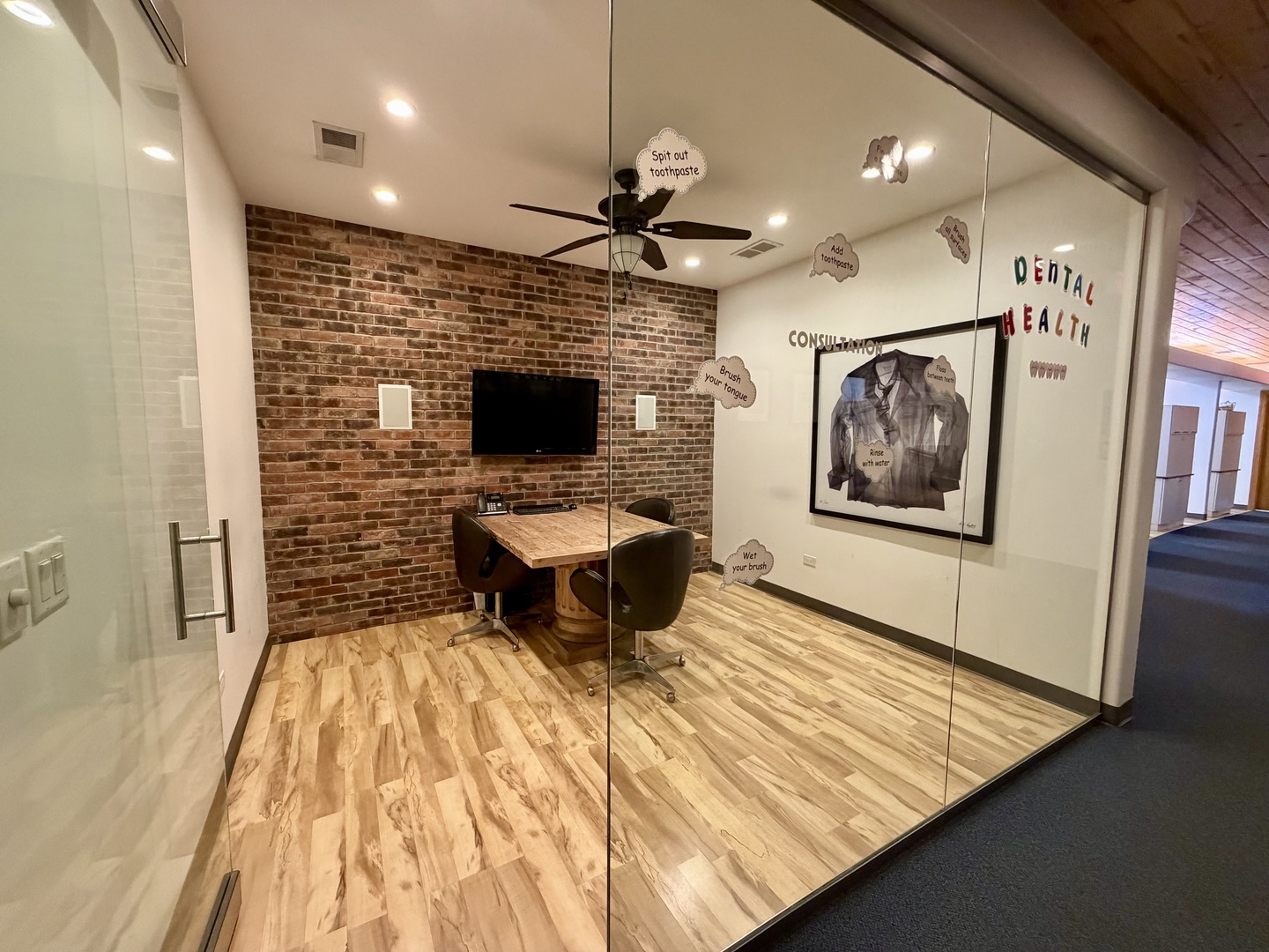 134 West State Street Sycamore, IL 60178 - Photo 11 of 20 a view of a hallway with wooden floor and a fireplace