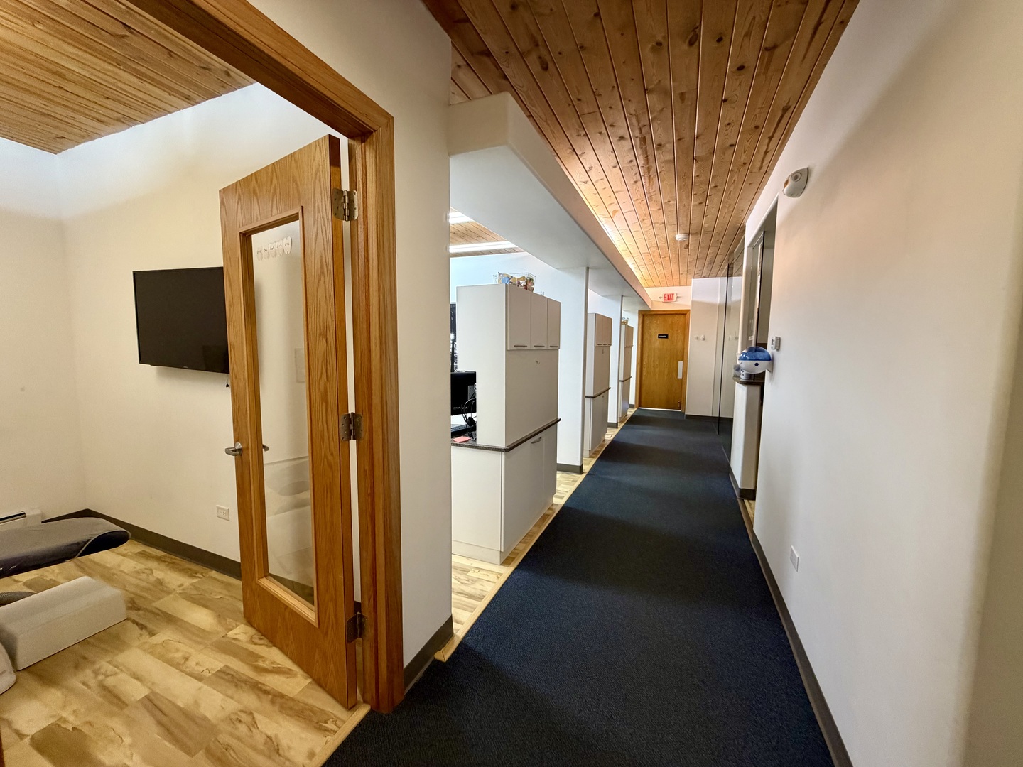134 West State Street Sycamore, IL 60178 - Photo 12 of 20 a view of a hallway with wooden floor and staircase