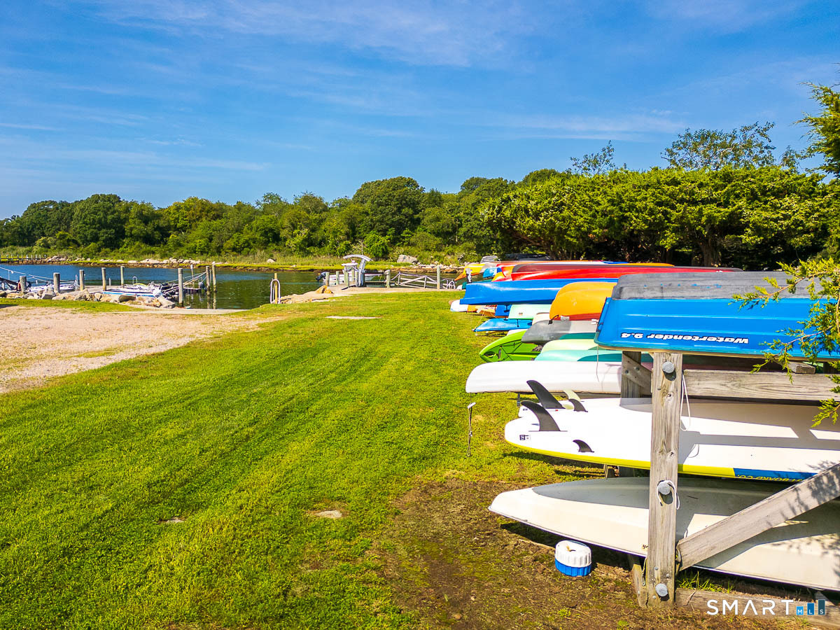 132 Latimer Point Road, Unit 132 Stonington, CT 06378 - Photo 31 of 38 Kayak racks await your launching to nautical adventures.