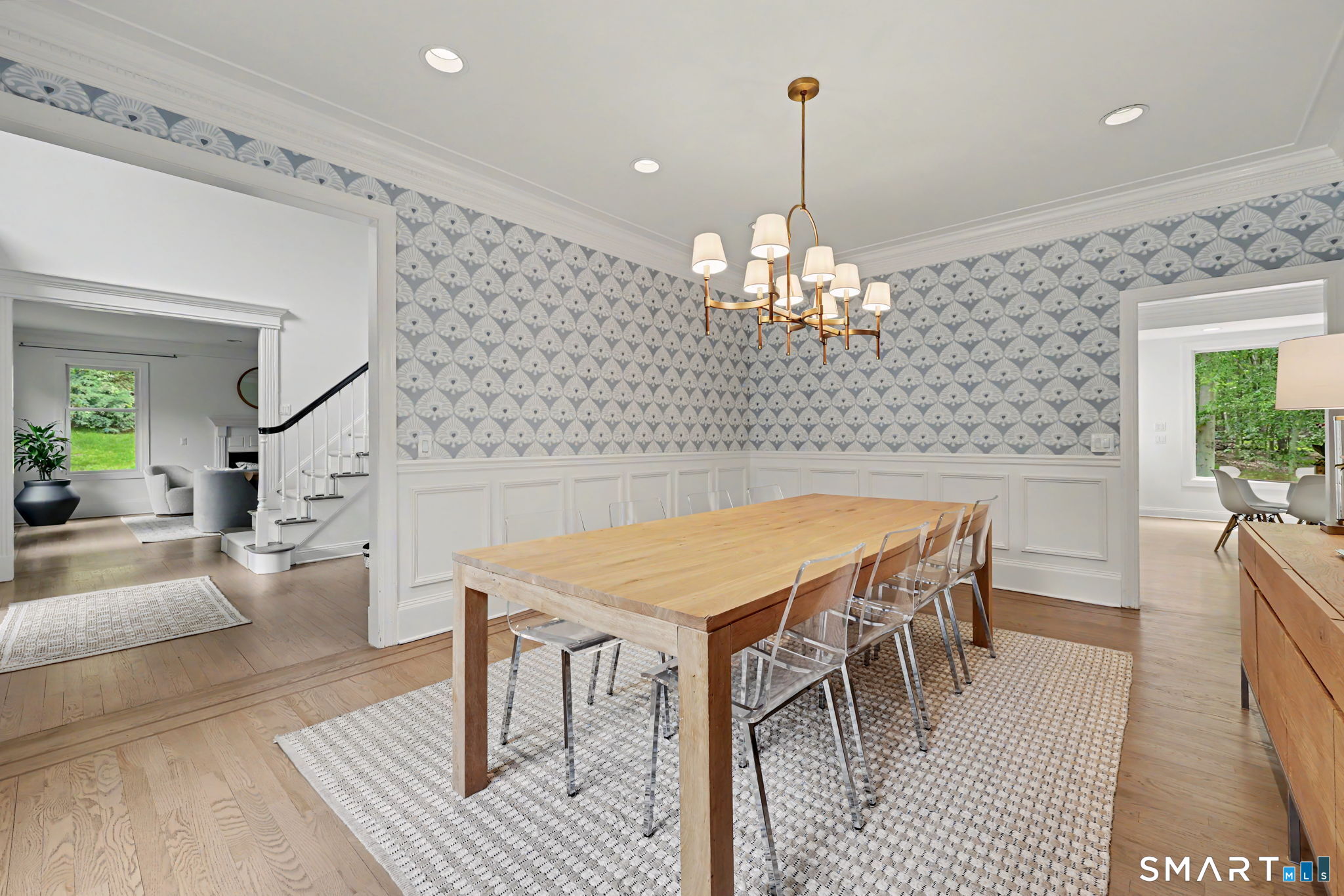 10 Side Hill Road Westport, CT 06880 - Photo 3 of 40 a dining room with furniture a chandelier and wooden floor