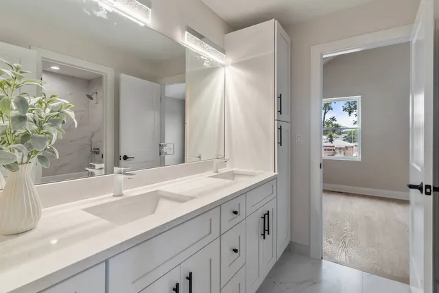 a bathroom with a sink and a mirror