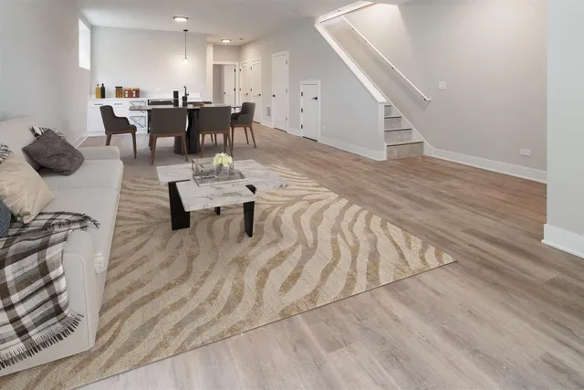 a living room with furniture and a table