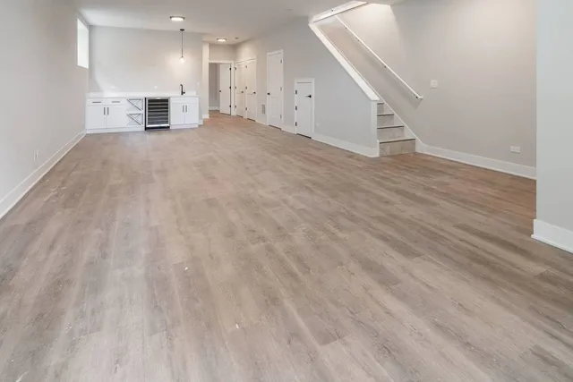 a view of a kitchen with a sink and a cabinet