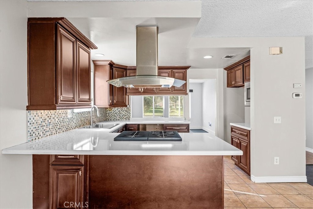 6240 Wiehe Avenue Riverside, CA 92506 - Photo 11 of 47 a kitchen with a stove and a sink