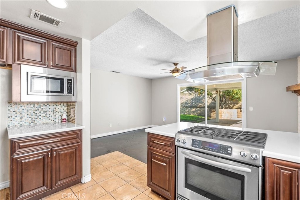 6240 Wiehe Avenue Riverside, CA 92506 - Photo 12 of 47 a kitchen with a stove and a microwave