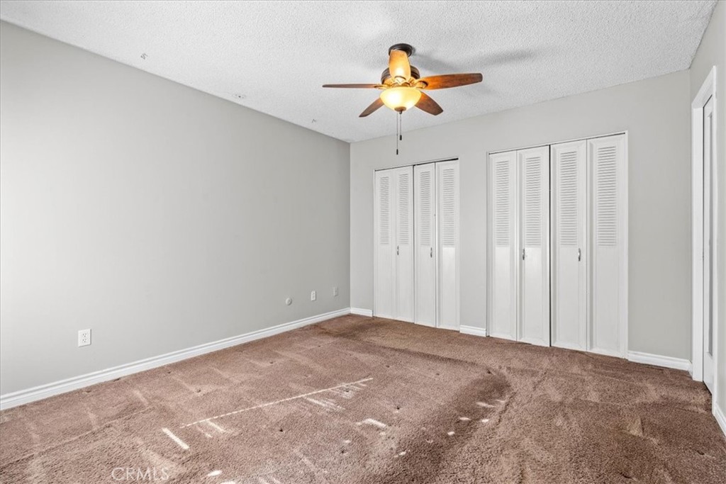 6240 Wiehe Avenue Riverside, CA 92506 - Photo 16 of 47 a view of a room with a ceiling fan and window