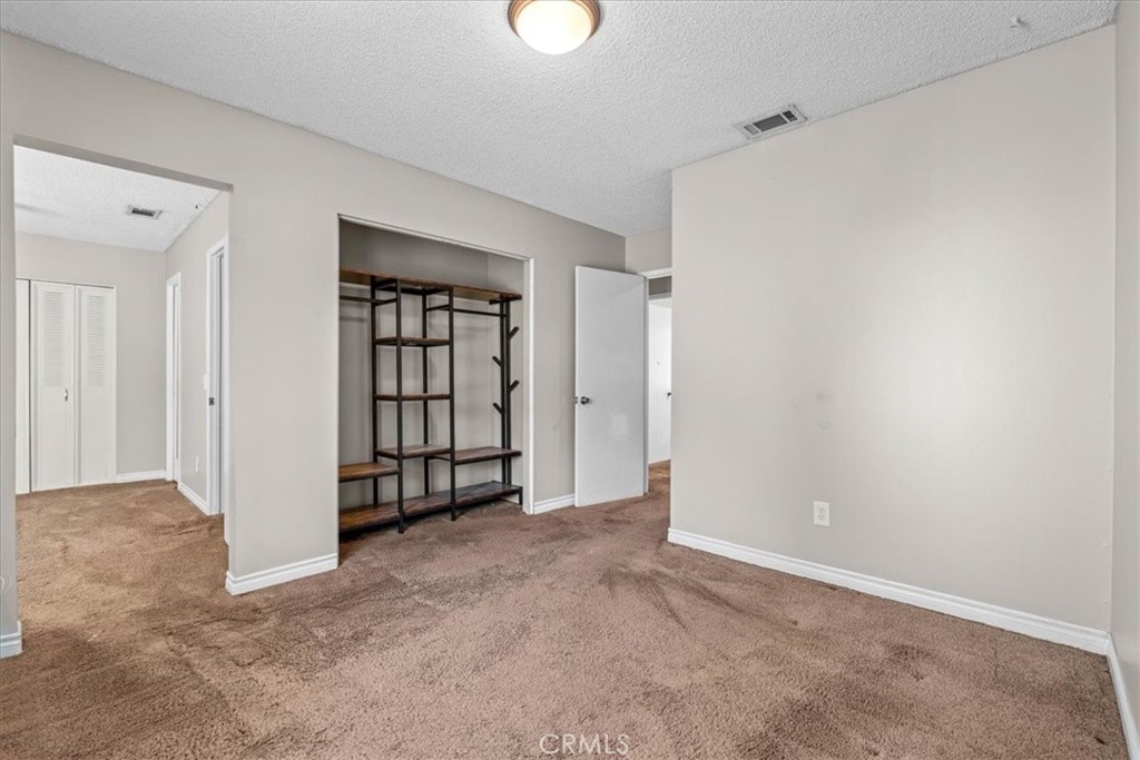 6240 Wiehe Avenue Riverside, CA 92506 - Photo 17 of 47 an empty room with windows and closet