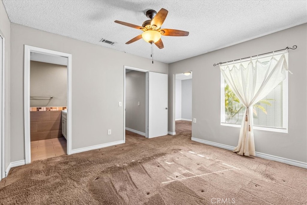 6240 Wiehe Avenue Riverside, CA 92506 - Photo 18 of 47 a view of a bedroom with a sink and a chandelier fan