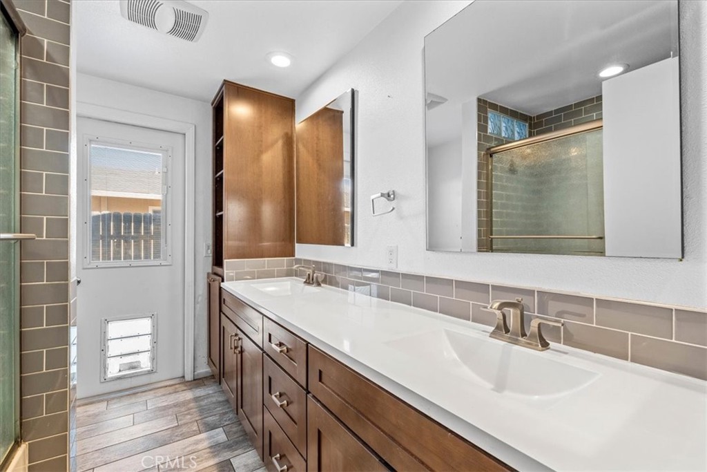 6240 Wiehe Avenue Riverside, CA 92506 - Photo 23 of 47 a bathroom with a sink double vanity and a mirror