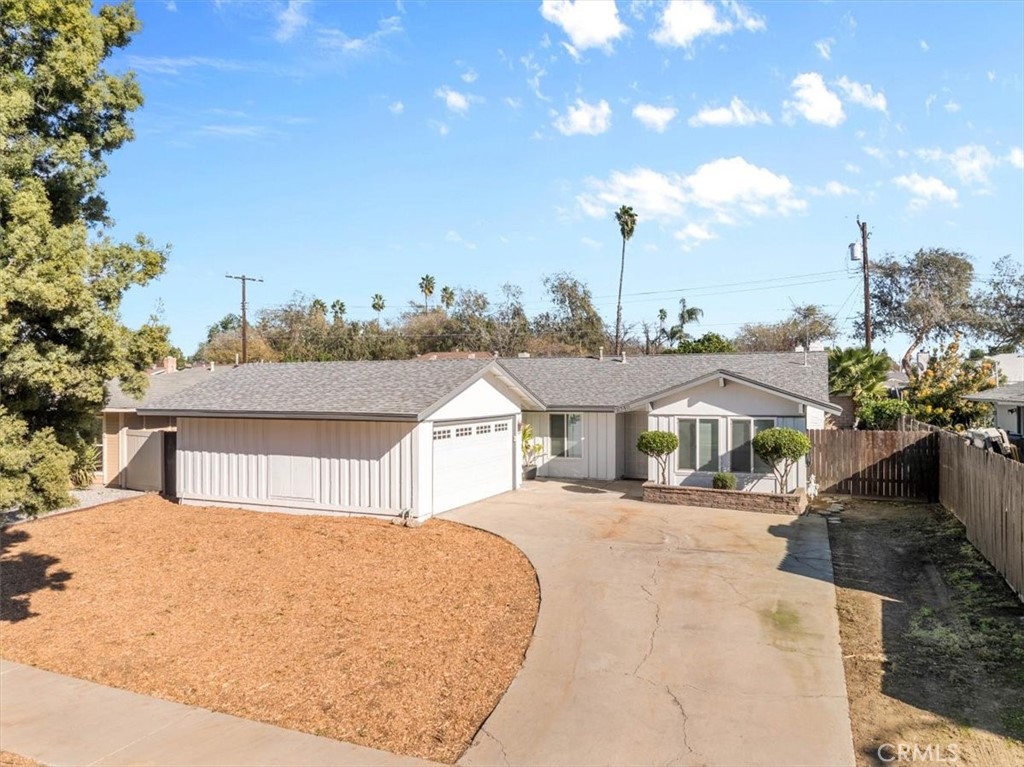6240 Wiehe Avenue Riverside, CA 92506 - Photo 29 of 47 a front view of a house with a garden and trees