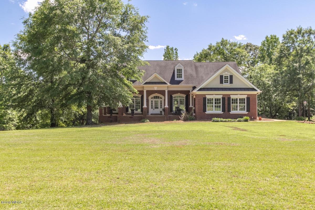 800 Pine Grove Church Road Culloden, GA 31016 - Photo 1 of 30 a front view of a house with a garden