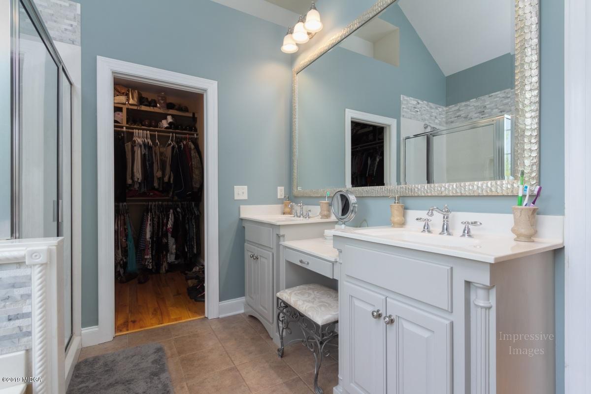 800 Pine Grove Church Road Culloden, GA 31016 - Photo 15 of 30 a bathroom with a sink a toilet and a mirror