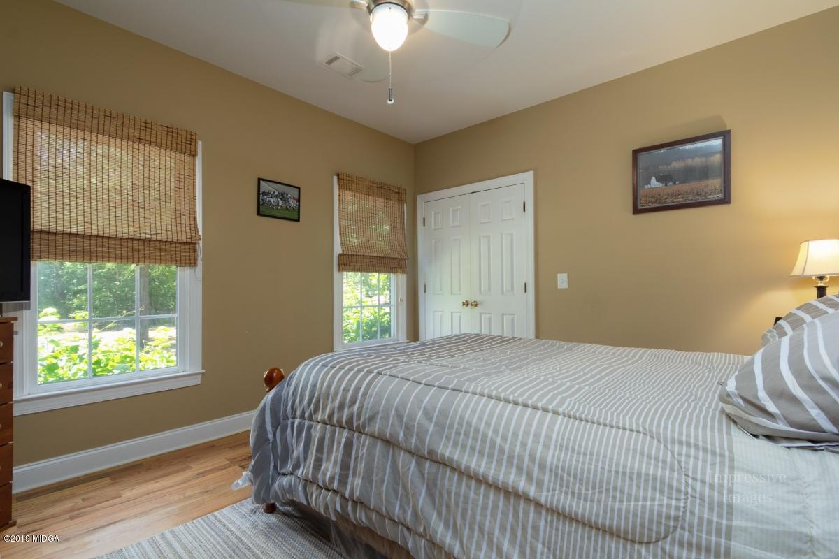 800 Pine Grove Church Road Culloden, GA 31016 - Photo 18 of 30 a bedroom with a bed and a window
