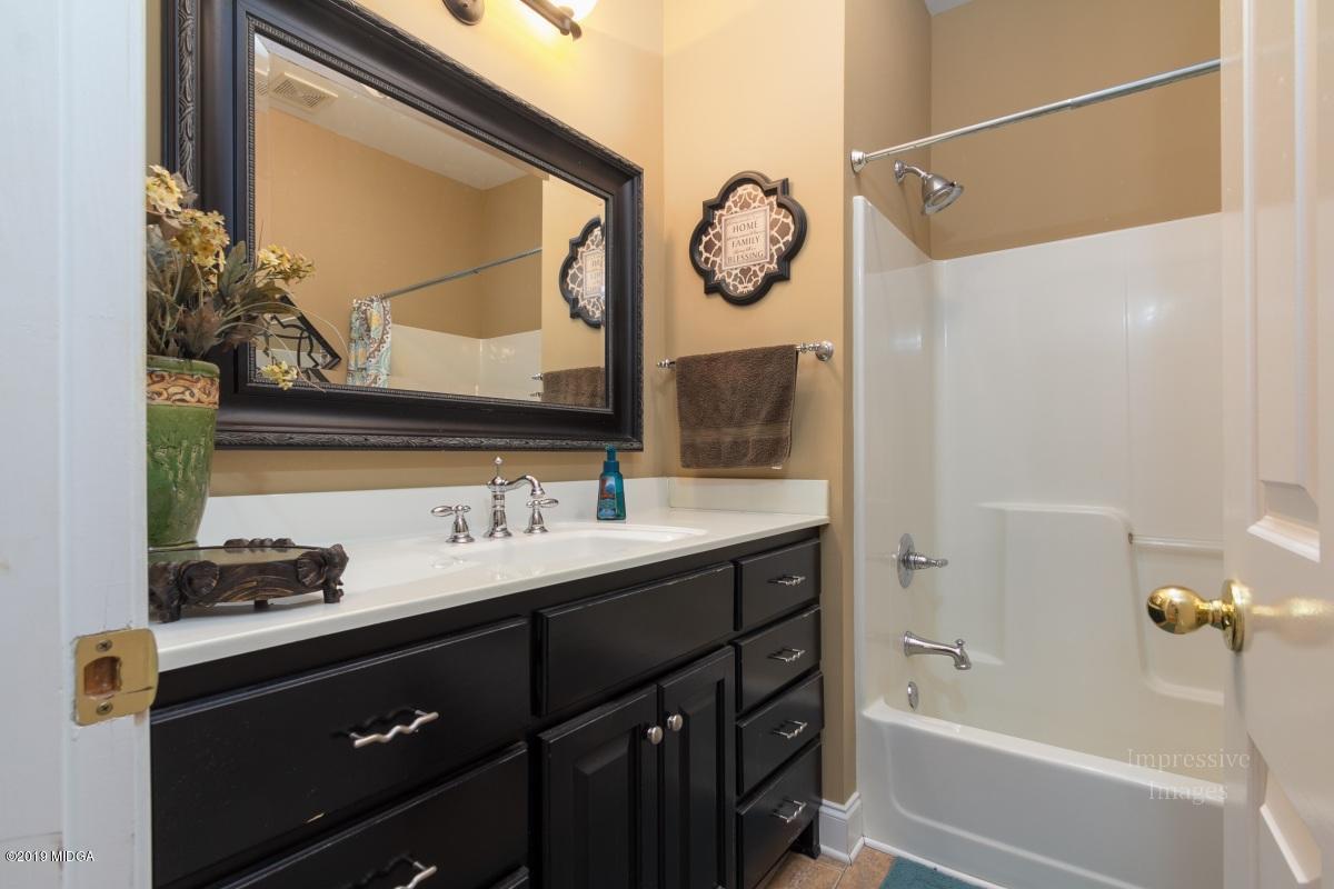 800 Pine Grove Church Road Culloden, GA 31016 - Photo 19 of 30 a bathroom with a sink and a mirror