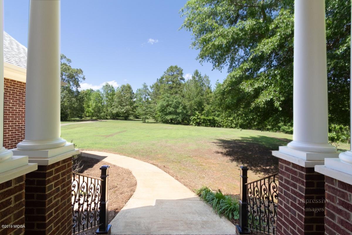 800 Pine Grove Church Road Culloden, GA 31016 - Photo 3 of 30 a view of a patio with a yard