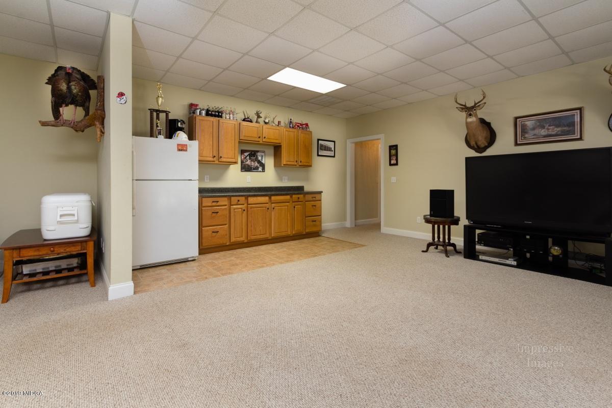 800 Pine Grove Church Road Culloden, GA 31016 - Photo 23 of 30 a room with furniture and a flat screen tv