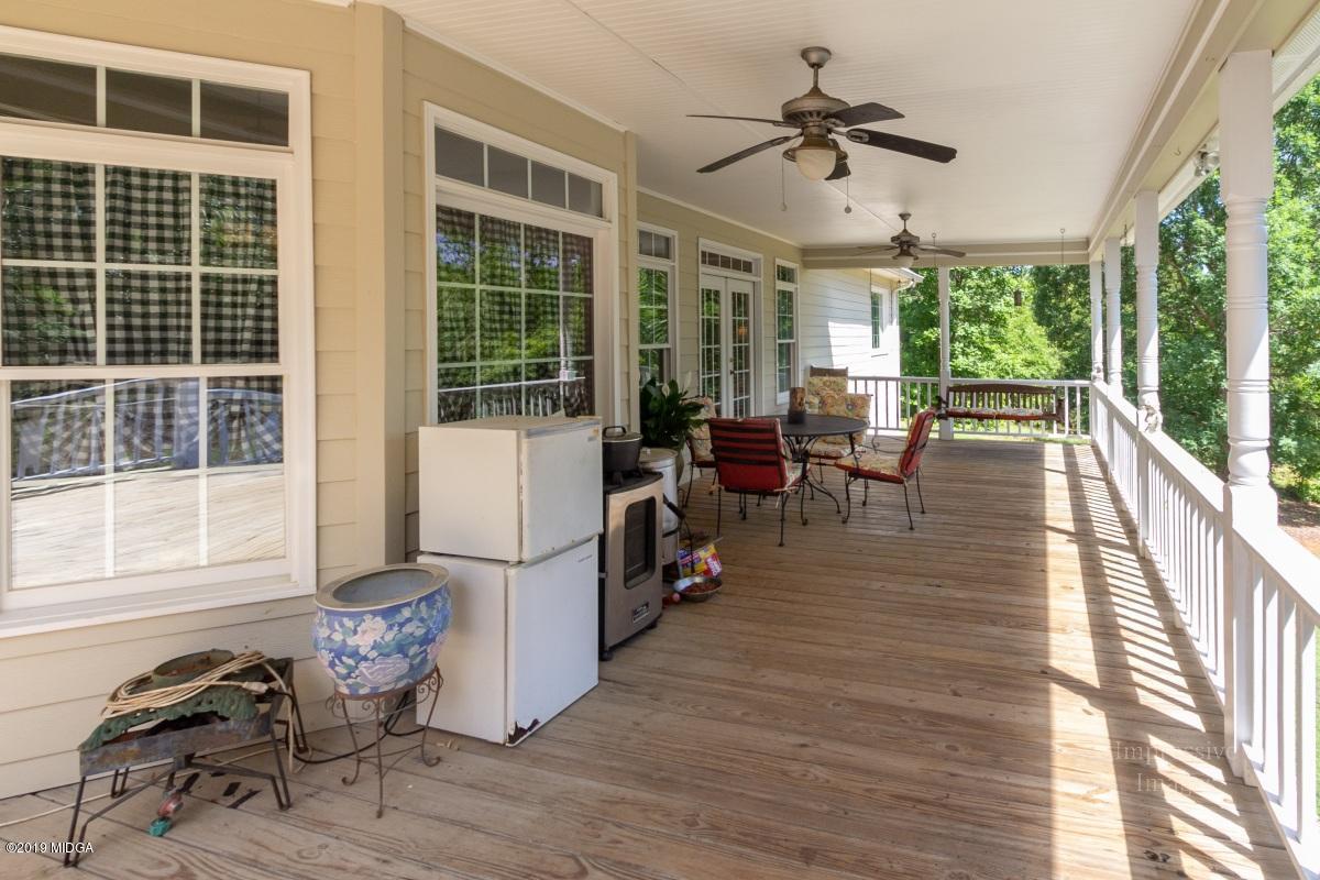 800 Pine Grove Church Road Culloden, GA 31016 - Photo 28 of 30 a living room with furniture and a large window