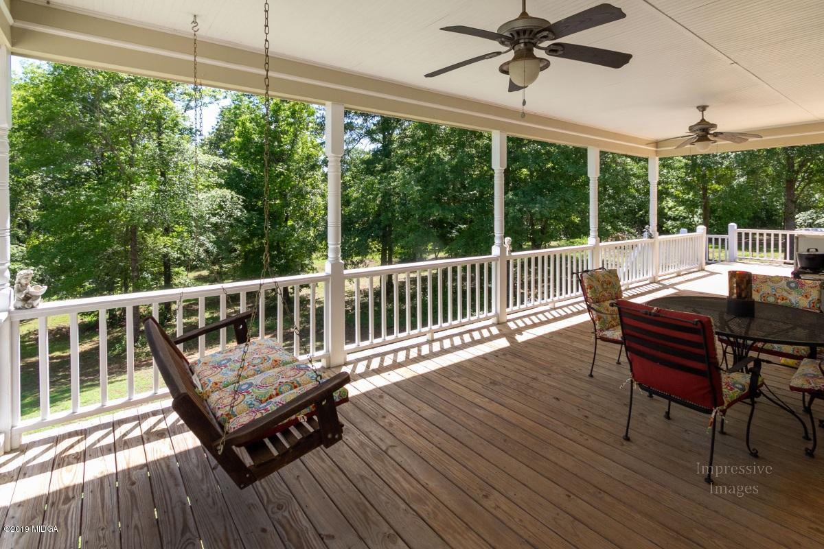 800 Pine Grove Church Road Culloden, GA 31016 - Photo 29 of 30 a view of a chairs on wooden deck