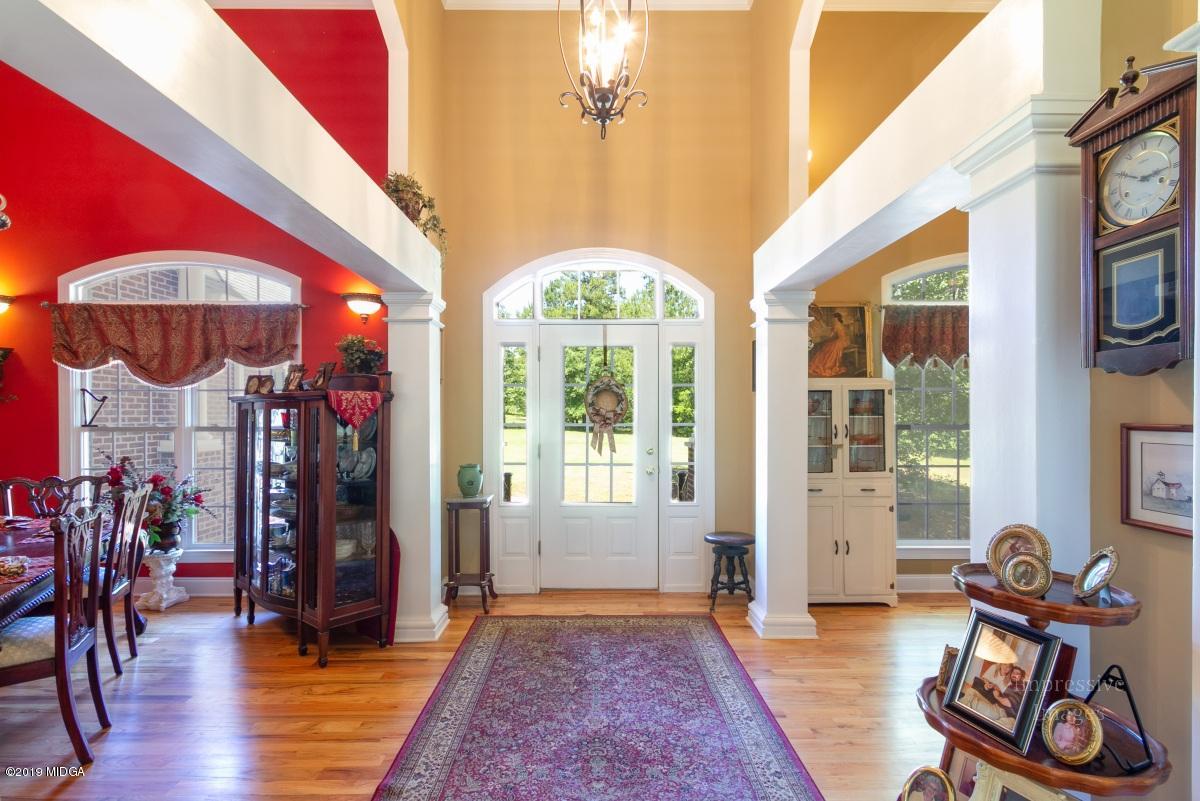 800 Pine Grove Church Road Culloden, GA 31016 - Photo 4 of 30 a view of an entryway with wooden floor and windows