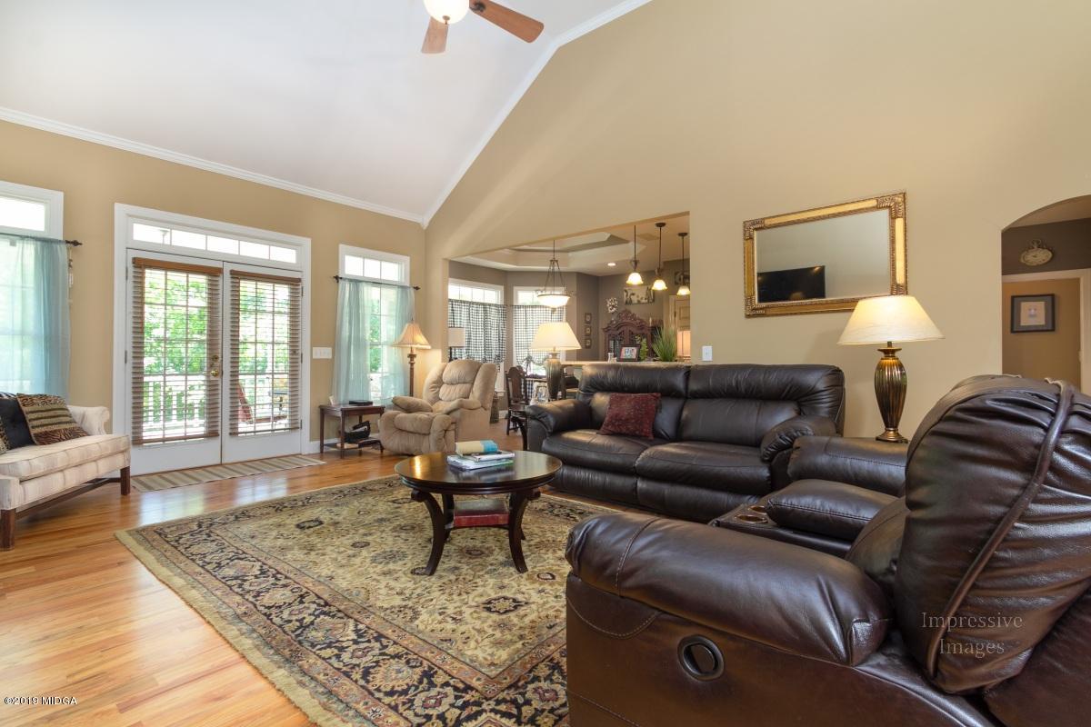800 Pine Grove Church Road Culloden, GA 31016 - Photo 7 of 30 a living room with furniture and a large window