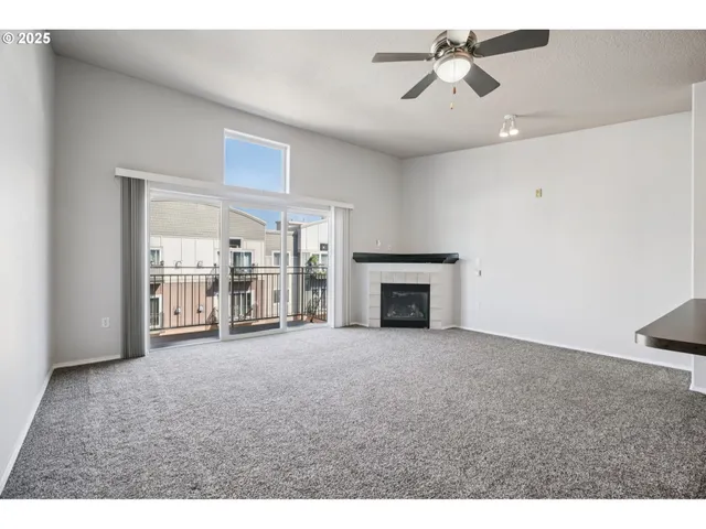 a view of empty room with fireplace