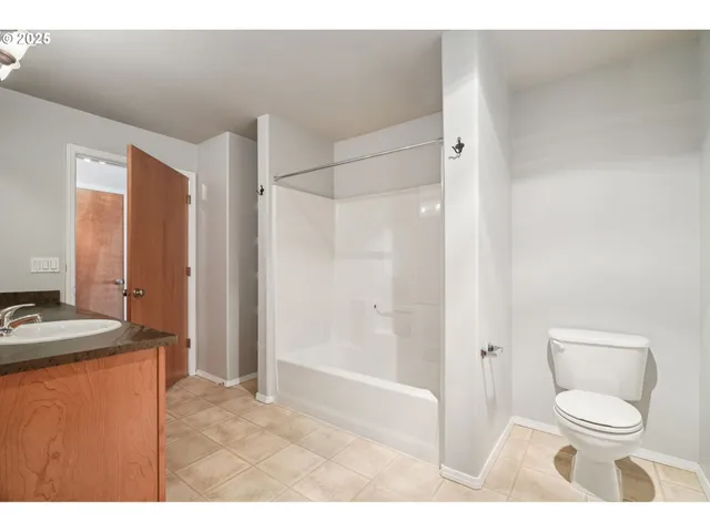 a bathroom with a sink toilet a shower and a mirror