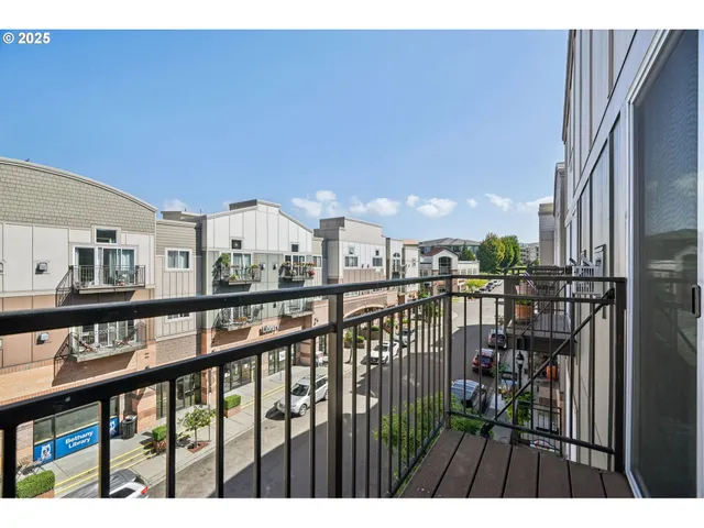 a view of a balcony with city view
