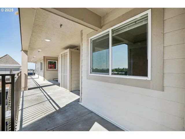 a view of a living room with a fireplace