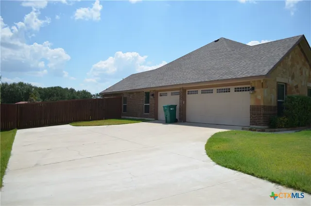 a house with yard in front of it