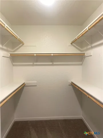 a view of an empty walk in closet