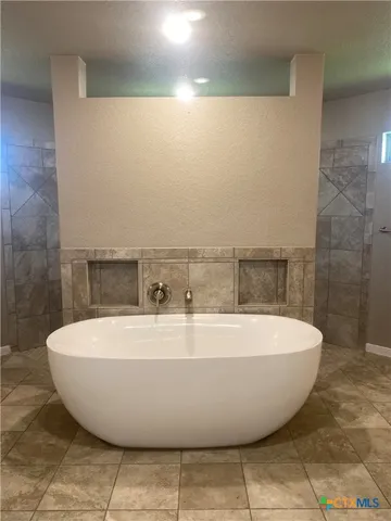 a view of a bathtub in a bathroom