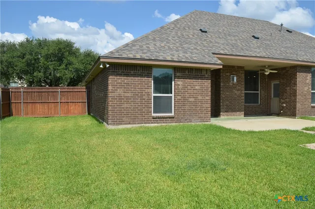 a view of a house with a garden