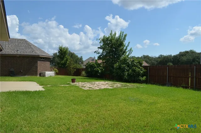 a view of a backyard with a garden